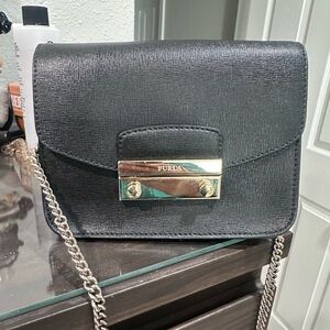 Furla mini Black Crossbody Bag with silver Hardware.